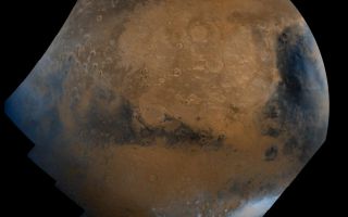 <h1>PIA00004:  Schiaparelli Hemisphere</h1><div class="PIA00004" lang="en" style="width:800px;text-align:left;margin:auto;background-color:#000;padding:10px;max-height:150px;overflow:auto;">This mosaic is composed of about 100 red- and violet- filter Viking Orbiter images, digitally mosaiced in an orthographic projection at a scale of 1 km/pixel. The images were acquired in 1980 during mid northern summer on Mars (Ls = 89 degrees). The center of the image is near the impact crater Schiaparelli (latitude -3 degrees, longitude 343 degrees). The limits of this mosaic are approximately latitude -60 to 60 degrees and longitude 280 to 30 degrees. The color variations have been enhanced by a factor of two, and the large-scale brightness variations (mostly due to sun-angle variations) have been normalized by large-scale filtering. The large circular area with a bright yellow color (in this rendition) is known as Arabia. The boundary between the ancient, heavily-cratered southern highlands and the younger northern plains occurs far to the north (latitude 40 degrees) on this side of the planet, just north of Arabia. The dark streaks with bright margins emanating from craters in the Oxia Palus region (to the left of Arabia) are caused by erosion and/or deposition by the wind. The dark blue area on the far right, called Syrtis Major Planum, is a low-relief volcanic shield of probable basaltic composition. Bright white areas to the south, including the Hellas impact basin at the lower right, are covered by carbon dioxide frost.<br /><br /><a href="http://photojournal.jpl.nasa.gov/catalog/PIA00004" onclick="window.open(this.href); return false;" title="Voir l'image 	 PIA00004:  Schiaparelli Hemisphere	  sur le site de la NASA">Voir l'image 	 PIA00004:  Schiaparelli Hemisphere	  sur le site de la NASA.</a></div>
