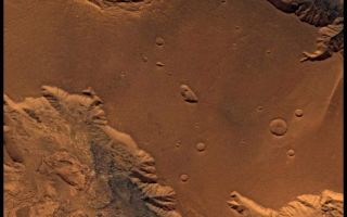 <h1>PIA00336:  West Candor Chasm, Approximately Natural Color</h1><div class="PIA00336" lang="en" style="width:800px;text-align:left;margin:auto;background-color:#000;padding:10px;max-height:150px;overflow:auto;">This picture (centered at latitude 4 degrees S., longitude 76 degrees W.) shows parts of central Valles Marineris, including Candor Chasm (lower left), Ophir Chasm (lower right), and Hebes Chasm (upper right). Complex layered deposits in the canyons may have been deposited in lakes, and if so, are of great interest for future searches for fossil life on Mars. The pinkish deposits in Candor Chasm (enhanced color version PIA00155) may be due to hydrothermal alterations and the production of crystalline ferric oxides (Geissler et al., 1993, Icarus 106, 380). Viking Orbiter Picture Numbers 279B02 (violet), 279B10 (green), and 279B12 (red) at 240 m/pixel resolution. Picture width is 2231 km. North is 47 degrees clockwise from top.<br /><br /><a href="http://photojournal.jpl.nasa.gov/catalog/PIA00336" onclick="window.open(this.href); return false;" title="Voir l'image 	 PIA00336:  West Candor Chasm, Approximately Natural Color	  sur le site de la NASA">Voir l'image 	 PIA00336:  West Candor Chasm, Approximately Natural Color	  sur le site de la NASA.</a></div>