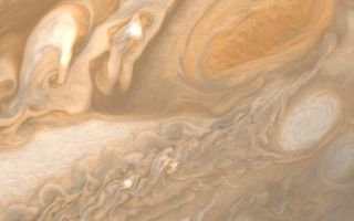 <h1>PIA00359:  Jupiter Great Red Spot and White Ovals</h1><div class="PIA00359" lang="en" style="width:800px;text-align:left;margin:auto;background-color:#000;padding:10px;max-height:150px;overflow:auto;">This photo of Jupiter was taken by Voyager 1 on March 1, 1979. The spacecraft was 3 million miles (5 million kilometers) from Jupiter at the time. The photo shows Jupiter's Great Red Spot (upper right) and the turbulent region immediately to the west. At the middle right of the frame is one of several white ovals seen on Jupiter from Earth. The structure in every feature here is far better than has ever been seen from any telescopic observations. The Red Spot and the white oval both reveal intricate and involved structure. The smallest details that can be seen in this photo are about 55 miles (95 kilometers) across. JPL manages and controls the Voyager project for NASA's Office of Space Science.<br /><br /><a href="http://photojournal.jpl.nasa.gov/catalog/PIA00359" onclick="window.open(this.href); return false;" title="Voir l'image 	 PIA00359:  Jupiter Great Red Spot and White Ovals	  sur le site de la NASA">Voir l'image 	 PIA00359:  Jupiter Great Red Spot and White Ovals	  sur le site de la NASA.</a></div>