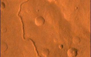 <h1>PIA00419:  Scamander Vallis</h1><div class="PIA00419" lang="en" style="width:318px;text-align:left;margin:auto;background-color:#000;padding:10px;max-height:150px;overflow:auto;"><p>A color image of Scamander Vallis on Mars; north toward top. The scene shows heavily cratered highlands dissected by the slightly sinuous gully of Scamander Vallis. The channel begins by dissecting a steep slope of an impact crater wall and abruptly ends about 180 km north of the crater.</p><p>This image is a composite of Viking medium-resolution images in black and white and low-resolution images in color. The image extends from latitude 13 degrees N. to 19 degrees N. and from longitude 330 degrees to 332 degrees; Mercator projection.</p><p>The lack of tributaries, fairly straight path, and steep walls of the channel suggest spring sapping as a mode of origin. The abrupt termination may have resulted from burial by younger deposits or perhaps the flows percolated into the surface materials and continued underground.<br /><br /><a href="http://photojournal.jpl.nasa.gov/catalog/PIA00419" onclick="window.open(this.href); return false;" title="Voir l'image 	 PIA00419:  Scamander Vallis	  sur le site de la NASA">Voir l'image 	 PIA00419:  Scamander Vallis	  sur le site de la NASA.</a></div>