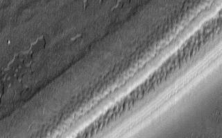 <h1>PIA00810:  Textures in south polar ice cap #2</h1><div class="PIA00810" lang="en" style="width:592px;text-align:left;margin:auto;background-color:#000;padding:10px;max-height:150px;overflow:auto;">Textures of the south polar permanent residual ice cap and polar layered terrains. This 15 x 14 km area image (frame 7306) is centered near 87 degrees south, 341 degrees west.<p>Figure caption from Science Magazine<br /><br /><a href="http://photojournal.jpl.nasa.gov/catalog/PIA00810" onclick="window.open(this.href); return false;" title="Voir l'image 	 PIA00810:  Textures in south polar ice cap #2	  sur le site de la NASA">Voir l'image 	 PIA00810:  Textures in south polar ice cap #2	  sur le site de la NASA.</a></div>