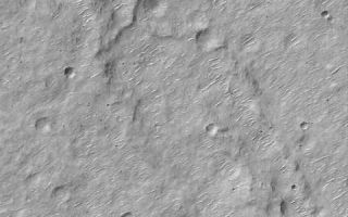 <h1>PIA01043:  MGS MOC Returns to Service Following Solar Conjunction Hiatus</h1><div class="PIA01043" lang="en" style="width:480px;text-align:left;margin:auto;background-color:#000;padding:10px;max-height:150px;overflow:auto;"><br>PIA01043<br>PIA01044<p>Many aspects of our studies of Mars from Earth are dictated by the different rates at which the two planets orbit the Sun. This difference allows Earth to pass Mars in its orbit, continue to lead Mars around the Sun, and then eventually overtake Mars again, every 26 months. This cycle governs opportunities to send rockets to Mars when the closest approaches between the two planets occur (opposition). The cycle also dictates when Mars will pass behind the Sun relative to Earth (conjunction). A Solar Conjunction period has just ended. During this time radio communications from the Mars Global Surveyor spacecraft, operating at Mars, were interrupted for a few weeks. Because it would not be able to send pictures back to Earth during this time, the Mars Global Surveyor (MGS) Mars Orbiter Camera (MOC) was turned off on June 21, 2000, and turned back on again July 13, 2000. The two pictures shown here are among the very first high resolution views of the martian surface that were received following the resumed operation of the MOC. Both pictures arrived on Earth via radio downlink on Saturday, July 15, 2000.<p>The first picture (above left) shows a ridged and cratered plain in southern Hesperia Planum around 32.8°S, 243.2°W. The second image (above right) shows the layered northeastern wall of a meteor impact crater in Noachis Terra at 32.9°S, 357.6°W. Both pictures cover an area 3 kilometers (1.9 miles) wide at a resolution of 6 meters per pixel. Both are illuminated by sunlight from the upper left.<br /><br /><a href="http://photojournal.jpl.nasa.gov/catalog/PIA01043" onclick="window.open(this.href); return false;" title="Voir l'image 	 PIA01043:  MGS MOC Returns to Service Following Solar Conjunction Hiatus	  sur le site de la NASA">Voir l'image 	 PIA01043:  MGS MOC Returns to Service Following Solar Conjunction Hiatus	  sur le site de la NASA.</a></div>