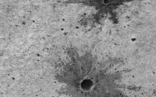 <h1>PIA01683:  Small Impact Craters with Dark Ejecta Deposits</h1><div class="PIA01683" lang="en" style="width:720px;text-align:left;margin:auto;background-color:#000;padding:10px;max-height:150px;overflow:auto;"><p>When a meteor impacts a planetary surface, it creates a blast very much like a bomb explosion. Shown here are two excellent examples of small impact craters on the martian surface. Each has a dark-toned deposit of material that was blown out of the crater (that is, ejected) during the impact. Materials comprising these deposits are called ejecta. The ejecta here is darker than the surrounding substrate because each crater-forming blast broke through the upper, brighter surface material and penetrated to a layer of darker material beneath. This darker material was then blown out onto the surface in the radial pattern seen here.</p><p>The fact that impact craters can penetrate and expose material from beneath the upper surface of a planet is very useful for geologists trying to determine the nature and composition of the martian subsurface. The scene shown here is illuminated from the upper left and covers an area 1.1 km (0.7 mi) wide by 1.4 km (0.9 mi). The larger crater has a diameter of about 89 meters (97 yards), the smaller crater is about 36 meters (39 yards) across. The picture is located in Terra Meridiani and was taken by the Mars Global Surveyor Mars Orbiter Camera.</p><p>Malin Space Science Systems and the California Institute of Technology built the MOC using spare hardware from the Mars Observer mission. MSSS operates the camera from its facilities in San Diego, CA. The Jet Propulsion Laboratory's Mars Surveyor Operations Project operates the Mars Global Surveyor spacecraft with its industrial partner, Lockheed Martin Astronautics, from facilities in Pasadena, CA and Denver, CO.<br /><br /><a href="http://photojournal.jpl.nasa.gov/catalog/PIA01683" onclick="window.open(this.href); return false;" title="Voir l'image 	 PIA01683:  Small Impact Craters with Dark Ejecta Deposits	  sur le site de la NASA">Voir l'image 	 PIA01683:  Small Impact Craters with Dark Ejecta Deposits	  sur le site de la NASA.</a></div>