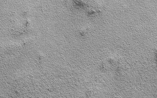 <h1>PIA01697:  Northern Plains Textures Visible Near the Terminator</h1><div class="PIA01697" lang="en" style="width:451px;text-align:left;margin:auto;background-color:#000;padding:10px;max-height:150px;overflow:auto;"><p>Each day, Mars Global Surveyor makes 12 orbits around the red planet. On each orbit at the present time (April 1999), the spacecraft passes from daylight into night somewhere over the northern plains of Mars, and re-emerges into daylight over the southern cratered highlands. The illumination conditions near the martian terminator--the line between night and day--are perfect for observing surface texture and topography. This picture shows a common, rough and bumpy texture that MOC has revealed on the northern plains of Mars. Note the eroded impact crater at the bottom right--small black dots along its rim are interpreted to be boulders. This image covers an area 3 kilometers (1.9 miles) wide by 8 kilometers (5 miles) long and is illuminated by the sun shining low from the northeastern horizon (from the upper right).</p><p>Malin Space Science Systems and the California Institute of Technology built the MOC using spare hardware from the Mars Observer mission. MSSS operates the camera from its facilities in San Diego, CA. The Jet Propulsion Laboratory's Mars Surveyor Operations Project operates the Mars Global Surveyor spacecraft with its industrial partner, Lockheed Martin Astronautics, from facilities in Pasadena, CA and Denver, CO.<br /><br /><a href="http://photojournal.jpl.nasa.gov/catalog/PIA01697" onclick="window.open(this.href); return false;" title="Voir l'image 	 PIA01697:  Northern Plains Textures Visible Near the Terminator	  sur le site de la NASA">Voir l'image 	 PIA01697:  Northern Plains Textures Visible Near the Terminator	  sur le site de la NASA.</a></div>