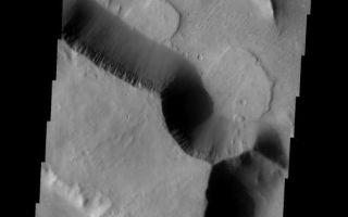 <h1>PIA01871:  Landslide</h1><div class="PIA01871" lang="en" style="width:524px;text-align:left;margin:auto;background-color:#000;padding:10px;max-height:150px;overflow:auto;"><p><a href="/figures/PIA01871_fig1.jpg"></a><br><b>Context image for PIA01871<br />Landslide</b></p><p>The two landslides in this image are located in Aeolis Mensae.<p>Image information: VIS instrument. Latitude -5.5N, Longitude 146.0E. 18 meter/pixel resolution.</p><p>Please see the <a href="http://themis.asu.edu/terms" target="_blank">THEMIS Data Citation Note</a> for details on crediting THEMIS images.</p><p>Note: this THEMIS visual image has not been radiometrically nor geometrically calibrated for this preliminary release. An empirical correction has been performed to remove instrumental effects. A linear shift has been applied in the cross-track and down-track direction to approximate spacecraft and planetary motion. Fully calibrated and geometrically projected images will be released through the Planetary Data System in accordance with Project policies at a later time.</p><p>NASA's Jet Propulsion Laboratory manages the 2001 Mars Odyssey mission for NASA's Office of Space Science, Washington, D.C. The Thermal Emission Imaging System (THEMIS) was developed by Arizona State University, Tempe, in collaboration with Raytheon Santa Barbara Remote Sensing. The THEMIS investigation is led by Dr. Philip Christensen at Arizona State University. Lockheed Martin Astronautics, Denver, is the prime contractor for the Odyssey project, and developed and built the orbiter. Mission operations are conducted jointly from Lockheed Martin and from JPL, a division of the California Institute of Technology in Pasadena.</p><br /><br /><a href="http://photojournal.jpl.nasa.gov/catalog/PIA01871" onclick="window.open(this.href); return false;" title="Voir l'image 	 PIA01871:  Landslide	  sur le site de la NASA">Voir l'image 	 PIA01871:  Landslide	  sur le site de la NASA.</a></div>