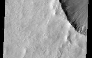 <h1>PIA01874:  Gullied Crater</h1><div class="PIA01874" lang="en" style="width:494px;text-align:left;margin:auto;background-color:#000;padding:10px;max-height:150px;overflow:auto;"><p><a href="/figures/PIA01874_fig1.jpg"></a><br><b>Context image for PIA01874<br />Gullied Crater</b></p><p>Gullies occur on the rim of this northern plains crater.<p>Image information: VIS instrument. Latitude 63.7N, Longitude 291.6E. 20 meter/pixel resolution.</p><p>Please see the <a href="http://themis.asu.edu/terms" target="_blank">THEMIS Data Citation Note</a> for details on crediting THEMIS images.</p><p>Note: this THEMIS visual image has not been radiometrically nor geometrically calibrated for this preliminary release. An empirical correction has been performed to remove instrumental effects. A linear shift has been applied in the cross-track and down-track direction to approximate spacecraft and planetary motion. Fully calibrated and geometrically projected images will be released through the Planetary Data System in accordance with Project policies at a later time.</p><p>NASA's Jet Propulsion Laboratory manages the 2001 Mars Odyssey mission for NASA's Office of Space Science, Washington, D.C. The Thermal Emission Imaging System (THEMIS) was developed by Arizona State University, Tempe, in collaboration with Raytheon Santa Barbara Remote Sensing. The THEMIS investigation is led by Dr. Philip Christensen at Arizona State University. Lockheed Martin Astronautics, Denver, is the prime contractor for the Odyssey project, and developed and built the orbiter. Mission operations are conducted jointly from Lockheed Martin and from JPL, a division of the California Institute of Technology in Pasadena.</p><br /><br /><a href="http://photojournal.jpl.nasa.gov/catalog/PIA01874" onclick="window.open(this.href); return false;" title="Voir l'image 	 PIA01874:  Gullied Crater	  sur le site de la NASA">Voir l'image 	 PIA01874:  Gullied Crater	  sur le site de la NASA.</a></div>