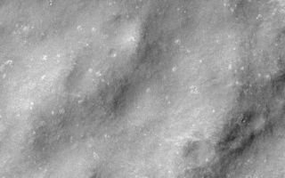 <h1>PIA02063:  MOC Providing Clues For Future Landing Site Selection</h1><div class="PIA02063" lang="en" style="width:754px;text-align:left;margin:auto;background-color:#000;padding:10px;max-height:150px;overflow:auto;"><p></p><p>One of the original objectives of the Mars Orbiter Camera (MOC) when it was proposed to NASA in 1985 was to take pictures that would be used to assess future spacecraft landing sites. Images obtained by the Mars Global Surveyor (MGS) MOC since March 1999 provide the highest resolution views (1.5 to 4.5 meters (5-15 ft) per pixel) of the planet ever seen. Over the past several months, MOC science personnel have been examining these new data to develop a general view of what Mars is like at the meter-scale within the general latitude and elevation range that will be accessible to the <a href="http://marsweb.jpl.nasa.gov/2001/index.html">Mars Surveyor 2001 lander</a>. (i.e., about 5°N to 15°S latitude and lower than 2.5 km (1.6 mi) elevation).</p><p>Because MOC images only cover a tiny fraction of one percent of the surface of Mars, we have been seeking general correlations that exist between what is seen in a MOC high-resolution image and what can be seen in the lower-resolution Viking and Mariner 9 images taken in 1972 and 1976-1980.</p><p>The most important results thus far are illustrated in the four pictures above. Nearly 70% of the terrain examined follows two very simple, but unexpected "rules" -- (1) If the terrain appears rugged at the hundreds of meters to kilometers scale in a Viking or Mariner image, then it will appear smooth at the meter-scale in a MOC image. (2) If the terrain appears to be smooth in the Viking or Mariner image, it will be rough in the meter-scale MOC image.</p><p>The image pair above illustrates the first "rule." MOC2-137a (left) shows a rugged plain in the martian southern cratered highlands near the Nepenthes Mensae. The small white box indicates the location of the MOC image, which is on the right (MOC2-137b). The MOC image reveals that while the terrain is rough at the large scale, it is quite smooth at the meter-scale.</p><p>The Viking image shown here is illuminated from the upper right, while the MOC image is illuminated from the upper left. The MOC image was taken in April 1999, while the Viking image was obtained in the late 1970s. More details about this work are provided in an extended abstract (in Acrobat® PDF format) by M.C. Malin, K. S. Edgett, and T. J. Parker, <a href="http://www.msss.com/mars/global_surveyor/camera/images/6_25_99_landingsites/malin_buffalo_abs.pdf">"Characterization of terrain in the Mars Surveyor 2001 landing site latitude and elevation region using Mapping Phase Mars Global Surveyor MOC images,"</a> presented at the Second Mars Surveyor Landing Site Workshop, held June 22-23, 1999, in Buffalo, New York.</p><p>Malin Space Science Systems and the California Institute of Technology built the MOC using spare hardware from the Mars Observer mission. MSSS operates the camera from its facilities in San Diego, CA. The Jet Propulsion Laboratory's Mars Surveyor Operations Project operates the Mars Global Surveyor spacecraft with its industrial partner, Lockheed Martin Astronautics, from facilities in Pasadena, CA and Denver, CO.</p><br /><br /><a href="http://photojournal.jpl.nasa.gov/catalog/PIA02063" onclick="window.open(this.href); return false;" title="Voir l'image 	 PIA02063:  MOC Providing Clues For Future Landing Site Selection	  sur le site de la NASA">Voir l'image 	 PIA02063:  MOC Providing Clues For Future Landing Site Selection	  sur le site de la NASA.</a></div>
