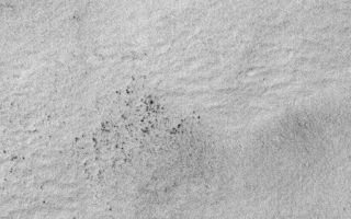 <h1>PIA02095:  Winter Frosts of the Retreating South Polar Cap</h1><div class="PIA02095" lang="en" style="width:512px;text-align:left;margin:auto;background-color:#000;padding:10px;max-height:150px;overflow:auto;"><p>July 1999--Spring is rapidly approaching for the martian southern hemisphere. Over the past month, much of the high southern latitudes of Mars have emerged from nearly 5 months of wintertime darkness, revealing a bright, frost-covered surface that presently extends from about 57°S to the south pole. Frosts at this time of year can consist of both frozen carbon dioxide ("dry ice") and frozen water. The above images are interpreted to show surfaces covered by water frost, because the temperature of the surface at the time the images were acquired was about -184°F or -120°C (visit the <a href="http://tes.la.asu.edu/daily.html">Thermal Emission Spectrometer</a> to see an example of their data). This temperature is above the freezing point of carbon dioxide (around -200°F = -130°C).</p><p>The pair of Mars Global Surveyor Mars Orbiter Camera (MOC) images presented here show a snow-covered surface located on Malea Planum, south of the giant Hellas impact basin. These pictures were taken simultaneously on July 18, 1999. The first image (left) is a MOC red camera wide angle context view showing the location of the higher-resolution narrow angle camera view (right). The white box in the context image indicates the location of the high-resolution view. Small black dots in the narrow angle image (right) are boulders and other surfaces from which the snow has been defrosted. The large crater in the wide angle (left) image is about 36 km (22 mi.) across. The narrow angle (right) image covers an area 3 km (1.9 mi)wide at a resolution of 3 meters (10 feet) per pixel. Illumination in each image is from the upper left.</p><p>Malin Space Science Systems and the California Institute of Technology built the MOC using spare hardware from the Mars Observer mission. MSSS operates the camera from its facilities in San Diego, CA. The Jet Propulsion Laboratory's Mars Surveyor Operations Project operates the Mars Global Surveyor spacecraft with its industrial partner, Lockheed Martin Astronautics, from facilities in Pasadena, CA and Denver, CO.<br /><br /><a href="http://photojournal.jpl.nasa.gov/catalog/PIA02095" onclick="window.open(this.href); return false;" title="Voir l'image 	 PIA02095:  Winter Frosts of the Retreating South Polar Cap	  sur le site de la NASA">Voir l'image 	 PIA02095:  Winter Frosts of the Retreating South Polar Cap	  sur le site de la NASA.</a></div>