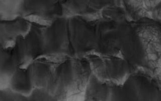 <h1>PIA02161:  D and D (Dunes and Devils)</h1><div class="PIA02161" lang="en" style="width:370px;text-align:left;margin:auto;background-color:#000;padding:10px;max-height:150px;overflow:auto;"><p>3 February 2006<br />This Mars Global Surveyor (MGS) Mars Orbiter Camera (MOC) image shows streaks created by late spring and early summer dust devils on a field of dark sand dunes on the floor of Hooke Crater.</p><p>Location near: 45.0°S, 44.8°W <br />Image width: ~3 km (~1.9 mi) <br />Illumination from: upper left <br />Season: Southern Summer </p><br /><br /><a href="http://photojournal.jpl.nasa.gov/catalog/PIA02161" onclick="window.open(this.href); return false;" title="Voir l'image 	 PIA02161:  D and D (Dunes and Devils)	  sur le site de la NASA">Voir l'image 	 PIA02161:  D and D (Dunes and Devils)	  sur le site de la NASA.</a></div>
