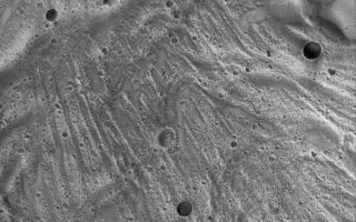 <h1>PIA02177:  Tithonium Landslide</h1><div class="PIA02177" lang="en" style="width:585px;text-align:left;margin:auto;background-color:#000;padding:10px;max-height:150px;overflow:auto;"><p>12 February 2006<br />This Mars Global Surveyor (MGS) Mars Orbiter Camera (MOC) image shows a portion of a large landslide deposit on the floor of western Tithonium Chasma.</p><p>Location near: 4.3°S, 87.9°W <br />Image width: ~3 km (~1.9 mi) <br />Illumination from: lower left <br />Season: Southern Summer </p><br /><br /><a href="http://photojournal.jpl.nasa.gov/catalog/PIA02177" onclick="window.open(this.href); return false;" title="Voir l'image 	 PIA02177:  Tithonium Landslide	  sur le site de la NASA">Voir l'image 	 PIA02177:  Tithonium Landslide	  sur le site de la NASA.</a></div>