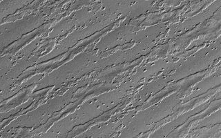 <h1>PIA02262:  South Polar Remnants</h1><div class="PIA02262" lang="en" style="width:672px;text-align:left;margin:auto;background-color:#000;padding:10px;max-height:150px;overflow:auto;"><p>25 February 2006<br />This Mars Global Surveyor (MGS) Mars Orbiter Camera (MOC) image shows the remains of a once more laterally extensive layer overlying undulating terrain very near the south polar residual cap. Removal of the overlying layer has created "windows" through which are revealed topographic variations in the underlying material, predominantly manifested in the form of ridges which run diagonally, from the southwest (lower left) to the northeast (upper right), across the scene.</p><p>Location near: 86.9°S, 196.0°W <br />Image width: ~3 km (~1.9 mi) <br />Illumination from: upper left <br />Season: Southern Summer </p><br /><br /><a href="http://photojournal.jpl.nasa.gov/catalog/PIA02262" onclick="window.open(this.href); return false;" title="Voir l'image 	 PIA02262:  South Polar Remnants	  sur le site de la NASA">Voir l'image 	 PIA02262:  South Polar Remnants	  sur le site de la NASA.</a></div>