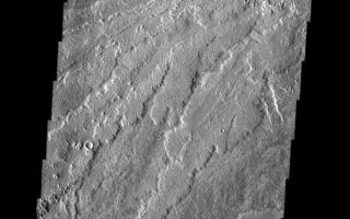 <h1>PIA02299:  Lava Flows</h1><div class="PIA02299" lang="en" style="width:548px;text-align:left;margin:auto;background-color:#000;padding:10px;max-height:150px;overflow:auto;"><p><a href="/figures/PIA02299_fig1.jpg"></a><br><b>Context image for PIA02299<br />Lava Flows</b></p><p>These lava flows are part of the Arsia Mons complex.</p><p>Image information: VIS instrument. Latitude -18.2N, Longitude 235.6E. 17 meter/pixel resolution.</p><p>Please see the <a href="http://themis.asu.edu/terms" target="_blank">THEMIS Data Citation Note</a> for details on crediting THEMIS images. </p><p>Note: this THEMIS visual image has not been radiometrically nor geometrically calibrated for this preliminary release. An empirical correction has been performed to remove instrumental effects. A linear shift has been applied in the cross-track and down-track direction to approximate spacecraft and planetary motion. Fully calibrated and geometrically projected images will be released through the Planetary Data System in accordance with Project policies at a later time.</p><p>NASA's Jet Propulsion Laboratory manages the 2001 Mars Odyssey mission for NASA's Office of Space Science, Washington, D.C. The Thermal Emission Imaging System (THEMIS) was developed by Arizona State University, Tempe, in collaboration with Raytheon Santa Barbara Remote Sensing. The THEMIS investigation is led by Dr. Philip Christensen at Arizona State University. Lockheed Martin Astronautics, Denver, is the prime contractor for the Odyssey project, and developed and built the orbiter. Mission operations are conducted jointly from Lockheed Martin and from JPL, a division of the California Institute of Technology in Pasadena.</p><br /><br /><a href="http://photojournal.jpl.nasa.gov/catalog/PIA02299" onclick="window.open(this.href); return false;" title="Voir l'image 	 PIA02299:  Lava Flows	  sur le site de la NASA">Voir l'image 	 PIA02299:  Lava Flows	  sur le site de la NASA.</a></div>