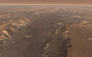 <h1>PIA02893:  High View of Melas</h1><div class="PIA02893" lang="en" style="width:800px;text-align:left;margin:auto;background-color:#000;padding:10px;max-height:150px;overflow:auto;"><p>Soaring high above Valles Marineris, the "Grand Canyon of Mars," viewers look down and catch a sight resembling parts of the desert West of the United States, but on a vastly greater scale. Here the canyon averages over a hundred miles wide, and its floor is heaped with rocks, sediments, and landslide debris. Within the canyon walls lie possibly hundreds of layers filling many pages of Mars' geologic record. </p><p>This scene comes from "<a href="/archive/PIA02891-95.mov">Flight Through Mariner Valley</a>," an exciting video produced for NASA by the Jet Propulsion Laboratory. The video takes viewers on a simulated flight into Valles Marineris, where they explore its scenic wonders as their imaginary scout ship dives low over landslides and races through winding canyons.</p><p>The video features high-resolution images from Arizona State University's Thermal Emission Imaging System multi-band camera on NASA's Mars Odyssey. The images, which show details as small as 300 meters (1,000 feet) across, were taken at infrared wavelengths during the Martian daytime. Scientists joined hundreds of individual frames from the camera into a giant mosaic, then colored the mosaic to approximate how Mars would appear to the human eye. </p><p>To give the mosaic depth and height, moviemakers fitted it to a computerized topographic model for Valles Marineris. This was developed using hundreds of thousands of altitude measurements by the Mars Orbiter Laser Altimeter, an instrument on NASA's Mars Global Surveyor spacecraft.</p><br /><br /><a href="http://photojournal.jpl.nasa.gov/catalog/PIA02893" onclick="window.open(this.href); return false;" title="Voir l'image 	 PIA02893:  High View of Melas	  sur le site de la NASA">Voir l'image 	 PIA02893:  High View of Melas	  sur le site de la NASA.</a></div>
