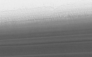 <h1>PIA02897:  North Polar Cap Layers and Frost on the First Day of Summer</h1><div class="PIA02897" lang="en" style="width:800px;text-align:left;margin:auto;background-color:#000;padding:10px;max-height:150px;overflow:auto;">A. PIA02897<br><br><br><br>86.5°N, 324.0°W --- 16 December 2000 --- illuminated from lower left 10 km (6.2 mi) wide by 3 km (1.9 mi) highB. <a href="/catalog/PIA02898">PIA02898</a><br><br><br><br>85.7°N, 307.9°W --- 2 December 2000 --- illuminated from upper left 2 km (1.2 mi) wide by 0.9 km (0.6 mi) highC. <a href="/catalog/PIA02899">PIA02899</a><br><br><br><br>87.0°N, 263.8°W --- 12 December 2000 --- illuminated from upper left 10 km (6.2 mi) wide by 3 km (1.9 mi) high<p>On Mars, Northern Hemisphere Summer (and Southern Hemisphere Winter) began on December 16, 2000. In this December holiday season, many children across the U.S. and elsewhere are perhaps anticipating an annual visit from a generous and jolly red-suited soul from the Earth's North Pole. As the December holidays were approaching, the Mars Global Surveyor (MGS) Mars Orbiter Camera (MOC) was busy acquiring new views of the region around the martian north pole. The three best views obtained this month are shown here. The top (A) and bottom (C) views show many layers exposed and eroded into the form of ridges and troughs on shallow slopes within the martian north polar cap. The middle (B) view is a picture of the rugged, eroded polar ice cap surface itself. The layers are believed to have formed over tens to hundreds of thousands of years by deposition of dust and ice each cold martian winter. These surfaces today all appear to have been eroded. The brightest material in each image is frost--temperatures at this time of year indicate that the frost is composed of frozen water. In winter, temperatures can be cold enough to freeze carbon dioxide, as well.<br /><br /><a href="http://photojournal.jpl.nasa.gov/catalog/PIA02897" onclick="window.open(this.href); return false;" title="Voir l'image 	 PIA02897:  North Polar Cap Layers and Frost on the First Day of Summer	  sur le site de la NASA">Voir l'image 	 PIA02897:  North Polar Cap Layers and Frost on the First Day of Summer	  sur le site de la NASA.</a></div>