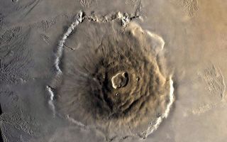 <h1>PIA02982:  Color Mosaic of Olympus Mons</h1><div class="PIA02982" lang="en" style="width:800px;text-align:left;margin:auto;background-color:#000;padding:10px;max-height:150px;overflow:auto;"><p>Color mosaic of Olympus Mons volcano on Mars from the Viking 1 Orbiter. The mosaic was created using images from orbit 735 taken 22 June 1978. Olympus Mons is about 600 km in diameter and the summit caldera is 24 km above the surrounding plains. The complex aureole terrain is visible at the top of the frame. North is up. (Viking 1 Orbiter MH20N133-735A)<br /><br /><a href="http://photojournal.jpl.nasa.gov/catalog/PIA02982" onclick="window.open(this.href); return false;" title="Voir l'image 	 PIA02982:  Color Mosaic of Olympus Mons	  sur le site de la NASA">Voir l'image 	 PIA02982:  Color Mosaic of Olympus Mons	  sur le site de la NASA.</a></div>