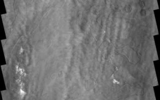 <h1>PIA03026:  Southern Clouds</h1><div class="PIA03026" lang="en" style="width:387px;text-align:left;margin:auto;background-color:#000;padding:10px;max-height:150px;overflow:auto;"><p><a href="/figures/PIA03026_fig1.jpg"></a><br><b>Context image for PIA03026<br />Southern Clouds</b></p><p>This image shows a system of clouds just off the margin of the South Polar cap. Taken during the summer season, these clouds contain both water-ice and dust.</p><p>Image information: VIS instrument. Latitude 80.2S, Longitude 57.6E. 17 meter/pixel resolution.</p><p>Note: this THEMIS visual image has not been radiometrically nor geometrically calibrated for this preliminary release. An empirical correction has been performed to remove instrumental effects. A linear shift has been applied in the cross-track and down-track direction to approximate spacecraft and planetary motion. Fully calibrated and geometrically projected images will be released through the Planetary Data System in accordance with Project policies at a later time.</p><p>NASA's Jet Propulsion Laboratory manages the 2001 Mars Odyssey mission for NASA's Office of Space Science, Washington, D.C. The Thermal Emission Imaging System (THEMIS) was developed by Arizona State University, Tempe, in collaboration with Raytheon Santa Barbara Remote Sensing. The THEMIS investigation is led by Dr. Philip Christensen at Arizona State University. Lockheed Martin Astronautics, Denver, is the prime contractor for the Odyssey project, and developed and built the orbiter. Mission operations are conducted jointly from Lockheed Martin and from JPL, a division of the California Institute of Technology in Pasadena.</p><br /><br /><a href="http://photojournal.jpl.nasa.gov/catalog/PIA03026" onclick="window.open(this.href); return false;" title="Voir l'image 	 PIA03026:  Southern Clouds	  sur le site de la NASA">Voir l'image 	 PIA03026:  Southern Clouds	  sur le site de la NASA.</a></div>