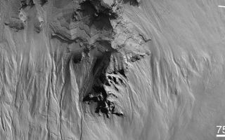 <h1>PIA03205:  Secrets of the Noachian Highlands: Pit Craters</h1><div class="PIA03205" lang="en" style="width:800px;text-align:left;margin:auto;background-color:#000;padding:10px;max-height:150px;overflow:auto;"><a href="/figures/PIA03205fig.gif"></a><br>A) Context Image<a href="/figures/PIA03205b.gif"></a><br>B) Gullies in M12-00595<a href="/tiff/PIA03205.tif"></a><br>C) Layers and gullies in M09-00539, M15-00964<br><p>Among the most exciting places that the Mars Global Surveyor (MGS) Mars Orbiter Camera (MOC) has photographed during its three and a half years in orbit has been this crater in central Noachis Terra. Located at 47°S, 355°W, the crater appears to have been almost completely filled, and subsequently eroded in localized pits, by unknown processes. In this one place we see elements of the two most important results of the MOC investigation--the discovery of young gullies formed by fluid erosion and the occurrence of thick sequences of layered rock attesting to a martian past of substantial geologic activity.<p>Picture A shows the location of the other two figures, which are sections of three of about a dozen images acquired of this crater. Picture B (M12-00595) shows examples of gullies on the pit walls. Their contributary pattern (including the angles at which they join) argues for fluid behavior during their creation; the dark floors suggest that they have been active recently (or else they, like the slopes around them and most of Mars, would be lighter-toned owing to the accumulation of dust). These gullies are formed well down on the pit wall, where a distinctive, boulder-rich layer is found. Figure C, a mosaic of two high resolution images (M09-00539 and M15-00964), shows an area somewhat higher in the sequence of layered material that fills the crater. This sequence clearly alternates between layers that either contain or erode to form boulders and layers that do not have boulders. Note in particular the overhanging layers near the top center--such overhangs are evidence of the strength of the material. Here, too, gullies appear to start at specific layers; these, however, may not be as young as those seen in (B), as they appear to have at least a thin covering of dust. How it is that this crater came to be filled with layers of material containing (or eroding to create) boulders is a mystery.<br /><br /><a href="http://photojournal.jpl.nasa.gov/catalog/PIA03205" onclick="window.open(this.href); return false;" title="Voir l'image 	 PIA03205:  Secrets of the Noachian Highlands: Pit Craters	  sur le site de la NASA">Voir l'image 	 PIA03205:  Secrets of the Noachian Highlands: Pit Craters	  sur le site de la NASA.</a></div>