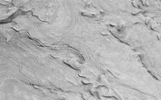 <h1>PIA03211:  Spectacular Layers Exposed in Becquerel Crater</h1><div class="PIA03211" lang="en" style="width:800px;text-align:left;margin:auto;background-color:#000;padding:10px;max-height:150px;overflow:auto;"><p>Toward the end of its Primary Mapping Mission, the Mars Global Surveyor (MGS) Mars Orbiter Camera (MOC) acquired one of its most spectacular pictures of layered sedimentary rock exposed within the ancient crater Becquerel. Pictures such as this one from January 25, 2001, underscore the fact that you never know from one day to the next what the next MOC images will uncover. While the Primary Mission ends January 31, 2001, thousands of new pictures--revealing as-yet-unseen terrain on the red planet--may be obtained during the Extended Mission phase, scheduled to run through at least April 2002.<p>The picture shown here reveals hundreds of light-toned layers in the 167 kilometers (104 miles) wide basin named for 19th Century French physicist Antoine H. Becquerel (1852-1908). These layers are interpreted to be sedimentary rocks deposited in the crater at some time in the distant past. They have since been eroded and exposed, revealing faults, dark layers between the bright layers, and a long geologic history (of unknown duration) recorded in these materials. Sets of parallel faults can be seen cutting across the layers in the left third of the image. Sunlight illuminates this scene from the top/upper right.<br /><br /><a href="http://photojournal.jpl.nasa.gov/catalog/PIA03211" onclick="window.open(this.href); return false;" title="Voir l'image 	 PIA03211:  Spectacular Layers Exposed in Becquerel Crater	  sur le site de la NASA">Voir l'image 	 PIA03211:  Spectacular Layers Exposed in Becquerel Crater	  sur le site de la NASA.</a></div>