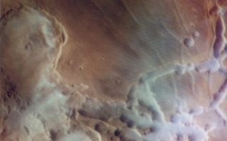 <h1>PIA03213:  Noctis Labyrinthus</h1><div class="PIA03213" lang="en" style="width:800px;text-align:left;margin:auto;background-color:#000;padding:10px;max-height:150px;overflow:auto;"><p>As the sun rises over Noctis Labyrinthus (the labyrinth of the night), bright clouds of water ice can be observed in and around the tributary canyons of this high plateau region of Mars. This color composite image, reconstructed through violet, green, and orange filters, vividly shows the distribution of clouds against the rust colored background of this Martian desert.<p>The picture was reconstructed by JPL's Image Processing Laboratory using in-flight calibration data to correct the color balance.<p>Scientists have puzzled why the clouds cling to the canyon areas and, only in certain areas, spill over onto the plateau surface. One possibility is that water which condensed during the previous afternoon in shaded eastern facing slopes of the canyon floor is vaporized as the early morning sun falls on those same slopes. The area covered is about 10,000 square kilometers (4000 square miles), centered at 9 degrees South, 95 degrees West, and the large partial crater at lower right is Oudemans. The picture was taken on Viking Orbiter 1's 40th orbit.<br /><br /><a href="http://photojournal.jpl.nasa.gov/catalog/PIA03213" onclick="window.open(this.href); return false;" title="Voir l'image 	 PIA03213:  Noctis Labyrinthus	  sur le site de la NASA">Voir l'image 	 PIA03213:  Noctis Labyrinthus	  sur le site de la NASA.</a></div>
