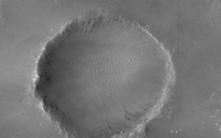 <h1>PIA03260:  Lonely Crater</h1><div class="PIA03260" lang="en" style="width:688px;text-align:left;margin:auto;background-color:#000;padding:10px;max-height:150px;overflow:auto;"><p>24 December 2005<br />This Mars Global Surveyor (MGS) Mars Orbiter Camera (MOC) image shows a full-resolution (1.5 meters/5 feet per pixel) view of an old meteor impact crater, somewhat filled with sediment. This crater is located near a larger crater, Newcomb, in far northern Noachis Terra.</p><p>Location near: 22.1°S, 1.1°W <br />Image width: ~1 km (~0.6 mi) <br />Illumination from: upper left <br />Season: Southern Spring </p><br /><br /><a href="http://photojournal.jpl.nasa.gov/catalog/PIA03260" onclick="window.open(this.href); return false;" title="Voir l'image 	 PIA03260:  Lonely Crater	  sur le site de la NASA">Voir l'image 	 PIA03260:  Lonely Crater	  sur le site de la NASA.</a></div>