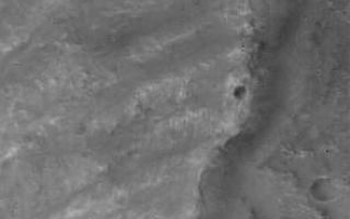 <h1>PIA03584:  Landslide in Mutch</h1><div class="PIA03584" lang="en" style="width:295px;text-align:left;margin:auto;background-color:#000;padding:10px;max-height:150px;overflow:auto;"><p>18 November 2005<br />This Mars Global Surveyor (MGS) Mars Orbiter Camera (MOC) image shows the east margin of a landslide off the southern rim of Mutch Crater in the Xanthe Terra region of Mars. This particular landslide was likely triggered by a meteor impact that occurred nearby.<p>Location near: 0.7°S, 55.9°W <br />Image width: width: ~3 km (~1.9 mi) <br />Illumination from: lower left <br />Season: Southern Spring </p><br /><br /><a href="http://photojournal.jpl.nasa.gov/catalog/PIA03584" onclick="window.open(this.href); return false;" title="Voir l'image 	 PIA03584:  Landslide in Mutch	  sur le site de la NASA">Voir l'image 	 PIA03584:  Landslide in Mutch	  sur le site de la NASA.</a></div>