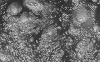 <h1>PIA03586:  8°N 7°W Crater</h1><div class="PIA03586" lang="en" style="width:800px;text-align:left;margin:auto;background-color:#000;padding:10px;max-height:150px;overflow:auto;"><p>20 November 2005<br />This Mars Global Surveyor (MGS) Mars Orbiter Camera (MOC) image shows light-toned, layered, sedimentary rock outcrops in an unnamed crater located at 8°N, 7°W. Dark, windblown sand enhances the contrast in this view. Hundreds of layers of repeated thickness and physical properties suggest that a cyclic or at least episodic process acted over a considerable period of time to deposit these materials in the crater. At the time the sediments were deposited, the crater might have hosted a lake.<p>Location near: 6.1°N, 10.7°W <br />Image width: width: ~3 km (~1.9 mi)<br />Illumination from: lower left <br />Season: Northern Autumn </p><br /><br /><a href="http://photojournal.jpl.nasa.gov/catalog/PIA03586" onclick="window.open(this.href); return false;" title="Voir l'image 	 PIA03586:  8°N 7°W Crater	  sur le site de la NASA">Voir l'image 	 PIA03586:  8°N 7°W Crater	  sur le site de la NASA.</a></div>