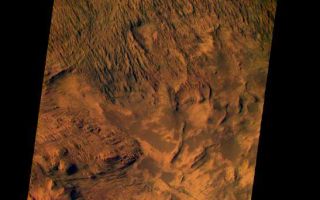 <h1>PIA03738:  Candor Chasma on Mars, in Color</h1><div class="PIA03738" lang="en" style="width:547px;text-align:left;margin:auto;background-color:#000;padding:10px;max-height:150px;overflow:auto;"><p>This image from the camera system on NASA.s Mars Odyssey was acquired of Candor Chasma within Valles Marineris, centered near 5 degrees south latitude, 283 degrees west longitude. This visible color image shows the effects of erosion on a sequence of dramatically layered rocks. These layers were initially deposited within Candor Chasma and have subsequently been eroded by a variety of processes, including wind and down-slope motion due to gravity. Relatively dark materials appear to mantle some areas of the layered deposits; these dark materials are likely sand. Few impact craters of any size can be seen in this image, indicating that the erosion and transport of material is occurring at a relatively rapid rate, so that any craters that form are rapidly buried or eroded. This image was acquired using the thermal infrared imaging system.s visible bands 1 (centered at 420nanometers), 2 (centered at 550 nanometers), and 3 (centered at 650nanometers), and covers an area approximately 19 kilometers (12 miles) in width by 50 kilometers (50 miles) in length.<p>The Jet Propulsion Laboratory, a division of the California Institute of Technology in Pasadena, manages the 2001 Mars Odyssey mission for NASA's Office of Space Science in Washington, D.C. Investigators at Arizona State University in Tempe, the University of Arizona in Tucson and NASA's Johnson Space Center, Houston, operate the science instruments. Additional science partners are located at the Russian Aviation and Space Agency and at Los Alamos National Laboratories, New Mexico. Lockheed Martin Astronautics, Denver, is the prime contractor for the project, and developed and built the orbiter. Mission operations are conducted jointly from Lockheed Martin and from JPL.<br /><br /><a href="http://photojournal.jpl.nasa.gov/catalog/PIA03738" onclick="window.open(this.href); return false;" title="Voir l'image 	 PIA03738:  Candor Chasma on Mars, in Color	  sur le site de la NASA">Voir l'image 	 PIA03738:  Candor Chasma on Mars, in Color	  sur le site de la NASA.</a></div>
