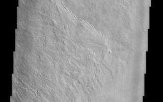 <h1>PIA03763:  Olympus Mons Lava Flows</h1><div class="PIA03763" lang="en" style="width:487px;text-align:left;margin:auto;background-color:#000;padding:10px;max-height:150px;overflow:auto;"><br>(Released 05 April 2002)<br>Olympus Mons stands 26 km above the surrounding plains, which is three times taller than Mt. Everest, and is the tallest volcano in the solar system. Olympus Mons is also wider (585 km) than the state of Arizona. Although these are impressive dimensions an astronaut would find walking these slopes easy, as they are typically only 2 to 5 degrees. This image contains numerous lava flows, leveed lava channels, a discontinuous sinuous rille (thought to be a collapsed lava tube) and lava plains. Close examination of the sinuous rille reveals that portions of the roof of the lava tube have not completely collapsed. All of these features can be seen in basaltic (iron and magnesium rich black rock) volcanic regions on Earth like Hawaii and Iceland. Impact craters are scarce, indicating a relatively young age (several hundred million years old) for these surfaces.<br /><br /><a href="http://photojournal.jpl.nasa.gov/catalog/PIA03763" onclick="window.open(this.href); return false;" title="Voir l'image 	 PIA03763:  Olympus Mons Lava Flows	  sur le site de la NASA">Voir l'image 	 PIA03763:  Olympus Mons Lava Flows	  sur le site de la NASA.</a></div>