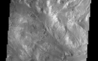 <h1>PIA03771:  Holden Crater/Uzboi Valles</h1><div class="PIA03771" lang="en" style="width:476px;text-align:left;margin:auto;background-color:#000;padding:10px;max-height:150px;overflow:auto;"><br>(Released 17 April 2002)<br><b>The Science</b><br>This image, located near 27.0S and 35.5W (324.5E), displays the intersection of Holden Crater with Uzboi Valles. This region of Mars contains a number of features that could be related to liquid water on the surface in the Martian past. Holden Crater contains finely layered sedimentary units that have been subsequently dissected. The hummucky terrain in the bottom half of the image is the remnants of this terrain, though the fine layers are not visible in this image at this resolution. The sedimentary units could have formed through deposition of material in a lacustrine type environment. Alternately, these layers could also be volcanic ash deposits. Uzboi Valles, which enters the crater from the southwest, is a catastrophic outflow channel that formed in the Martian past. The streamlined nature of the topographic features at the intersection of the crater with Uzboi Valles record the erosional pattern of flowing liquid water on the surface of Mars during the episodic outflow event.<br><br><b>The Story</b><br>Mars doesn't have a shortage of rugged terrain, and this area is no exception. While things look pretty quiet now, this cratered region was once the scene of some tremendous action. Long ago in Martian history, an incoming meteoroid probably smashed into the planet and produced a giant impact crater named Holden Crater, which stretches 88 miles across the Martian surface. The history of the area around Holden Crater doesn?t stop there. At some point, a catastrophic flood burst forth on the surface, forming an impressive outflow channel called Uzboi Valles. No one knows exactly how that happened, or whether the water might even have rushed into Holden Crater at some point, forming a long-ago lake. What we do know is that there is a lot of sedimentary material that could have formed in two hypothesized ways: in an ancient lake environment or as volcanic-ash deposits.<br><br>Scientists are searching for the answers by studying the region where Uzboi Valles meets the crater. You can see the rough edge of Holden Crater running diagonally down in a sharply edged swath (from the top left-hand corner of this image to the center right-hand side). Just below it, running almost smoothly down the right-hand side of the image is an intriguing channel where water may once have flowed. Much of the terrain in the bottom half of the image, in fact, seems to be cut into a swish-swash of dissected sedimentary terrain. Sliced through in such a way, the terrain ends up carrying bunches of small, rounded hills called "hummocks." Earth can boast of its own rolling, hummocky terrain too, such as that found in the ravine-cut Missouri Hills and High Plains areas of South Dakota.<br /><br /><a href="http://photojournal.jpl.nasa.gov/catalog/PIA03771" onclick="window.open(this.href); return false;" title="Voir l'image 	 PIA03771:  Holden Crater/Uzboi Valles	  sur le site de la NASA">Voir l'image 	 PIA03771:  Holden Crater/Uzboi Valles	  sur le site de la NASA.</a></div>