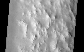 <h1>PIA03788:  Degraded Crater Rim</h1><div class="PIA03788" lang="en" style="width:490px;text-align:left;margin:auto;background-color:#000;padding:10px;max-height:150px;overflow:auto;"><br>(Released 3 May 2002)<br><b>The Science</b><br>The eastern rim of this unnamed crater in Southern Arabia Terra is very degraded (beaten up). This indicates that this crater is very ancient and has been subjected to erosion and subsequent bombardment from other impactors such as asteroids and comets. One of these later (younger) craters is seen in the upper right of this image superimposed upon the older crater rim material. Note that this smaller younger crater rim is sharper and more intact than the older crater rim. This region is also mantled with a blanket of dust. This dust mantle causes the underlying topography to take on a more subdued appearance.<br><br><b>The Story</b><br>When you think of Arabia, you probably think of hot deserts and a lot of profitable oil reserves. On Mars, however, Southern Arabia Terra is a cold place of cratered terrain. This almost frothy-looking image is the badly battered edge of an ancient crater, which has suffered both erosion and bombardment from asteroids, comets, or other impacting bodies over the long course of its existence. A blanket of dust has also settled over the region, which gives the otherwise rugged landscape a soft and more subdued appearance.<br><br>The small, round crater (upper left) seems almost gemlike in its setting against the larger crater ring. But this companionship is no easy romance. Whatever formed the small crater clearly whammed into the larger crater rim at some point, obliterating part of its edge. You can tell the small crater was formed after the first and more devastating impact, because it is laid over the other larger crater. How much younger is the small one? Well, its rim is also much sharper and more intact, which gives a sense that it is probably far more youthful than the very degraded, ancient crater.<br /><br /><a href="http://photojournal.jpl.nasa.gov/catalog/PIA03788" onclick="window.open(this.href); return false;" title="Voir l'image 	 PIA03788:  Degraded Crater Rim	  sur le site de la NASA">Voir l'image 	 PIA03788:  Degraded Crater Rim	  sur le site de la NASA.</a></div>