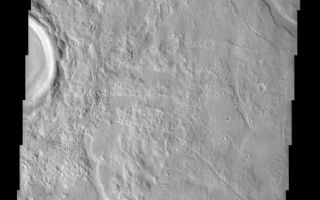 <h1>PIA03796:  Utopia Planitia</h1><div class="PIA03796" lang="en" style="width:474px;text-align:left;margin:auto;background-color:#000;padding:10px;max-height:150px;overflow:auto;"><br>(Released 15 May 2002)<br><b>The Science</b><br>This image is located in Utopia Planitia, a large plain in the northern hemisphere. It is believed that this basin is the result of a large impact. On the right side of the image is a partially imaged crater with a well-preserved ejecta blanket. The morphology of the ejecta implies that the crater is young relative to the surrounding material and has not undergone extensive deposition or erosion. Surrounding the crater are polygonal troughs in the smooth surface material. This polygon pattern is relatively common in the northern plains of Mars, and are primarily located in Acidalia Planitia, Elysium Planitia, and Utopia Planitia. These troughs are believed to be small grabbens, however, scientist are currently debating the origin of these features. The two most accepted hypotheses are that these grabbens either form as volcanic material cools and contracts, or are produced as sediment shrinks as a result of compaction.<br><br><b>The Story</b><br>When you think of Utopia, you probably don't think of a large Martian plain, riddled with troughs and pockmarked by craters. Of course, it may actually be a more fitting name than you think. When Sir Thomas More wrote his book about a fictitiously optimal place guided and governed by reason, he made up the word utopia from Greek words meaning "nowhere."<br><br>Utopia Planitia became "somewhere" for the first time, however, when its first visitor, the Viking 2 lander, settled down and analyzed the area. And scientists today are using their own reasoning and logic to discern even more about how this northern Martian plain developed geologically.<br><br>Right now, scientists have two hypotheses for how the troughs seen here were formed. Because Utopia Planitia is a volcanic region of Mars, these rifts in the surface could have formed when volcanic material cooled and then contracted. Alternatively, this area might be made up of a lot of sediments - small particles of rock, soil, and dust deposited in the area. Just like any loose material, it could have compacted together in places or "shrunk down" to create the lowered rifts in the terrain.<br><br>The polygonal patterns of these troughs can be seen more widely in the context image to the right. On Earth, we can sometimes see this pattern occurring in the Arctic and subarctic, where permafrost creates polygonal, "frozen-soil wedges" that form an almost honeycomb pattern throughout the terrain. We know from Viking 2 pictures that it can be pretty cold in this area, as a thin layer of white ground frost was observed there during a few of the Martian winters.<br><br>The whiter, brighter material near the crater, however, isn't frost or snow, but instead the record of all of the material that was once ejected from the crater at the left-hand-side of the image. You can see by the smoothness of the crater rim and the clarity of where the ejected material landed that there hasn't been much erosion. That means this crater is fairly young.<br /><br /><a href="http://photojournal.jpl.nasa.gov/catalog/PIA03796" onclick="window.open(this.href); return false;" title="Voir l'image 	 PIA03796:  Utopia Planitia	  sur le site de la NASA">Voir l'image 	 PIA03796:  Utopia Planitia	  sur le site de la NASA.</a></div>