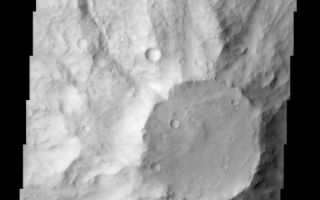 <h1>PIA03837:  Small Volcano in Terra Cimmeria</h1><div class="PIA03837" lang="en" style="width:481px;text-align:left;margin:auto;background-color:#000;padding:10px;max-height:150px;overflow:auto;"><br>(Released 26 June 2002)<br><br><b>The Science</b><br>This positive relief feature (see MOLA context) in the ancient highlands of Mars appears to be a heavily eroded volcanic center. The top of this feature appears to be under attack by the erosive forces of the martian wind. Light-toned streaks are visible, trending northeast to southwest, and may be caused by scouring of the terrain, or they may be dune forms moving sand. The northeast portion of the caldera area looks as though a layer of material is being removed to expose a slightly lighter-toned surface underneath. The flanks of this feature are slightly less cratered than the surrounding terrain, which could be explained in two ways: 1) this feature may be younger than the surrounding area, and has had less time to accumulate meteorite impacts, or 2) the slopes that are observed today may be so heavily eroded that the original, cratered surfaces are now gone, exposing relatively uncratered rocks. Although most of Terra Cimmeria has low albedo, some eastern portions, such as shown in this image, demonstrate an overall lack of contrast that attests to the presence of a layer of dust mantling the surface. This dust, in part, is responsible for the muted appearance and infill of many of the craters at the northern and southern ends of this image<br><br><b>The Story</b><br>This flat-topped volcano pops out from the surface, the swirls of its ancient lava flows running down onto the ancient highlands of Mars. Its smooth top appears to be under attack by the erosive forces of the martian wind.<br><br>How can you tell? Click on the image above for a close-up look. You'll see some light-toned streaks that run in a northeast-southwest direction. They are caused either by the scouring of the terrain or dunes of moving sand. Either way, the wind likely plays upon the volcano's surface. Look also for the subtle, nearly crescent shaped feature at the northeast portion of the volcano's cap. It looks as if a layer of material has been removed by the wind, exposing a slightly lighter-toned surface underneath.<br><br>The sides of the volcano are less cratered than the rest of the terrain. Perhaps that means it is younger than the surrounding area and has had less time to accumulate meteorite impacts. On the other hand, perhaps erosion has scrubbed away the original cratered surfaces. It's a little hard to tell which possibility holds the key to the history of this area.<br><br>Although most of Terra Cimmeria can look relatively darker (has a low albedo or low "reflective power") than some other Martian areas, its eastern portions sometimes have an overall lack of contrast as seen in the above image. A layer of dust blankets the surface here, causing it to look muted. Many of the craters in the northern and southern ends of the image also seem subdued, as dust has partly filled in the stark holes they once created.<br><br>The Cimmerians who give their name to this region were an ancient, little-known people of southern Russia mentioned in Assyrian inscriptions and by Homer.<br /><br /><a href="http://photojournal.jpl.nasa.gov/catalog/PIA03837" onclick="window.open(this.href); return false;" title="Voir l'image 	 PIA03837:  Small Volcano in Terra Cimmeria	  sur le site de la NASA">Voir l'image 	 PIA03837:  Small Volcano in Terra Cimmeria	  sur le site de la NASA.</a></div>