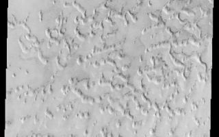 <h1>PIA03903:  Frosted Sand Dunes</h1><div class="PIA03903" lang="en" style="width:480px;text-align:left;margin:auto;background-color:#000;padding:10px;max-height:150px;overflow:auto;"><a href="/figures/PIA03903a-context.jpg"></a><br>(Released 22 July 2002)<br>This image, located near 79.6 N and 142.7 E, displays sand dunes covered in CO2 frost. This is a region of Mars that contains circumpolar sand seas. The large sand deposits and the high winds that circulate around the pole allow for the formation of a huge dune field that surrounds the north polar cap. As the northern hemisphere progresses towards winter, CO2  frost condenses out of the atmosphere and covers the dunes. During northern spring, the CO2 sublimates and the dunes are once again uncovered and active. This image was taken as northern spring progresses and the crests of the dunes are just starting to be exposed. The dark dune material absorbs sunlight more efficiently than the brighter frost, aiding in the sublimation of the remaining frost.<br /><br /><a href="http://photojournal.jpl.nasa.gov/catalog/PIA03903" onclick="window.open(this.href); return false;" title="Voir l'image 	 PIA03903:  Frosted Sand Dunes	  sur le site de la NASA">Voir l'image 	 PIA03903:  Frosted Sand Dunes	  sur le site de la NASA.</a></div>