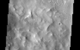 <h1>PIA03909:  Poynting Crater Ejecta</h1><div class="PIA03909" lang="en" style="width:487px;text-align:left;margin:auto;background-color:#000;padding:10px;max-height:150px;overflow:auto;"><a href="/figures/PIA03909a-context.jpg"></a><br>(Released 30 July 2002)<br>Located roughly equidistant between two massive volcanoes, the approximately 60 km Poynting Crater and its ejecta have experienced an onslaught of volcanic activity. Pavonis Mons to the south and Ascraeus Mons to the north are two of the biggest volcanoes on Mars. They have supplied copious amounts of lava and presumably, ash and tephra to the region. This THEMIS image captures evidence for these volcanic materials. The rugged mound of material that dominates the center of the image likely is ejecta from Poynting Crater just 40 km to the west (see MOLA context image). The textural features of this mound are surprisingly muted, giving the appearance that the image is out of focus or has atmospheric obscuration. But the surrounding terrain shows clear textural details and the mound itself displays tiny craters and protruding peaks that demonstrate the true clarity of the image. One conclusion is that the ejecta mound is covered by a mantle of material that could be related to its proximity to the big volcanoes. The tephra and ash deposits produced by these volcanoes could easily accumulate to a thickness that would bury any textural details that originally existed on the ejecta mound. In contrast, the lava flows that lap up to the base of the mound show clear textural details, indicating that they came after the eruptive activity that mantled the ejecta mound. Given the fact that any ejecta material is preserved at all suggests that the impact that produced Poynting Crater postdated the major construction phase of the volcanoes.<br><br /><br /><a href="http://photojournal.jpl.nasa.gov/catalog/PIA03909" onclick="window.open(this.href); return false;" title="Voir l'image 	 PIA03909:  Poynting Crater Ejecta	  sur le site de la NASA">Voir l'image 	 PIA03909:  Poynting Crater Ejecta	  sur le site de la NASA.</a></div>