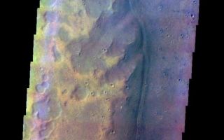 <h1>PIA03931:  Acidalia Planitia Channel Margin</h1><div class="PIA03931" lang="en" style="width:614px;text-align:left;margin:auto;background-color:#000;padding:10px;max-height:150px;overflow:auto;"><a href="/figures/PIA03931_fig1.jpg"></a><br /><p>The THEMIS VIS camera is capable of capturing color images of the Martian surface using five different color filters. In this mode of operation, the spatial resolution and coverage of the image must be reduced to accommodate the additional data volume produced from using multiple filters. To make a color image, three of the five filter images (each in grayscale) are selected. Each is contrast enhanced and then converted to a red, green, or blue intensity image. These three images are then combined to produce a full color, single image. Because the THEMIS color filters don't span the full range of colors seen by the human eye, a color THEMIS image does not represent true color. Also, because each single-filter image is contrast enhanced before inclusion in the three-color image, the apparent color variation of the scene is exaggerated. Nevertheless, the color variation that does appear is representative of some change in color, however subtle, in the actual scene. Note that the long edges of THEMIS color images typically contain color artifacts that do not represent surface variation.</p><p>This false color image shows craters and a channel margin, in the region of southern Acidalia Planitia where Tiu and Ares Valles empty into the planitia. This image was collected during the Northern Spring season.</p><p>Image information: VIS instrument. Latitude 23.8, Longitude 327.5 East (32.5 West). 37 meter/pixel resolution.</p><p>Note: this THEMIS visual image has not been radiometrically nor geometrically calibrated for this preliminary release. An empirical correction has been performed to remove instrumental effects. A linear shift has been applied in the cross-track and down-track direction to approximate spacecraft and planetary motion. Fully calibrated and geometrically projected images will be released through the Planetary Data System in accordance with Project policies at a later time.</p><p>NASA's Jet Propulsion Laboratory manages the 2001 Mars Odyssey mission for NASA's Office of Space Science, Washington, D.C. The Thermal Emission Imaging System (THEMIS) was developed by Arizona State University, Tempe, in collaboration with Raytheon Santa Barbara Remote Sensing. The THEMIS investigation is led by Dr. Philip Christensen at Arizona State University. Lockheed Martin Astronautics, Denver, is the prime contractor for the Odyssey project, and developed and built the orbiter. Mission operations are conducted jointly from Lockheed Martin and from JPL, a division of the California Institute of Technology in Pasadena.</p><br /><br /><a href="http://photojournal.jpl.nasa.gov/catalog/PIA03931" onclick="window.open(this.href); return false;" title="Voir l'image 	 PIA03931:  Acidalia Planitia Channel Margin	  sur le site de la NASA">Voir l'image 	 PIA03931:  Acidalia Planitia Channel Margin	  sur le site de la NASA.</a></div>