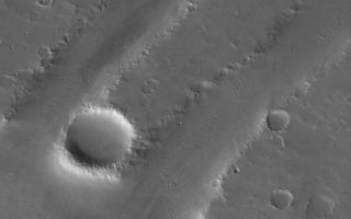 <h1>PIA03967:  Troughs in Tharsis</h1><div class="PIA03967" lang="en" style="width:468px;text-align:left;margin:auto;background-color:#000;padding:10px;max-height:150px;overflow:auto;"><p>25 June 2005<br />This Mars Global Surveyor (MGS) Mars Orbiter Camera (MOC) image shows a dust-covered landscape in northern Tharsis, including several troughs formed by faults as the crust in the region expanded, long ago.</p><p>Location near: 25.8°N, 98.2°W <br />Image width: ~3 km (~1.9 mi) <br />Illumination from: lower left <br />Season Northern Autumn <br /></p><br /><br /><a href="http://photojournal.jpl.nasa.gov/catalog/PIA03967" onclick="window.open(this.href); return false;" title="Voir l'image 	 PIA03967:  Troughs in Tharsis	  sur le site de la NASA">Voir l'image 	 PIA03967:  Troughs in Tharsis	  sur le site de la NASA.</a></div>