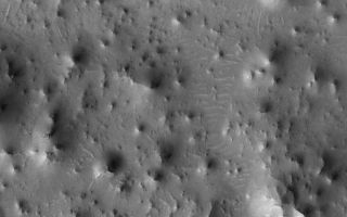 <h1>PIA03978:  Knobby Eastern Arabia</h1><div class="PIA03978" lang="en" style="width:689px;text-align:left;margin:auto;background-color:#000;padding:10px;max-height:150px;overflow:auto;"><p>2 July 2005<br />This Mars Global Surveyor (MGS) Mars Orbiter Camera (MOC) image shows a 1.4 meters per pixel (~5 ft/pixel) view of an eroded landscape north of the crater, Antoniadi, in far eastern Arabia Terra. Each knob and butte in this image is a remanant of a formerly more-extensive layered rock unit that has been largely eroded away.</p><p>Location near: 84.2°S, 138.3°W <br />Image width: ~3 km (~1.9 mi) <br />Illumination from: upper left <br />Season Southern Spring </p><br /><br /><a href="http://photojournal.jpl.nasa.gov/catalog/PIA03978" onclick="window.open(this.href); return false;" title="Voir l'image 	 PIA03978:  Knobby Eastern Arabia	  sur le site de la NASA">Voir l'image 	 PIA03978:  Knobby Eastern Arabia	  sur le site de la NASA.</a></div>