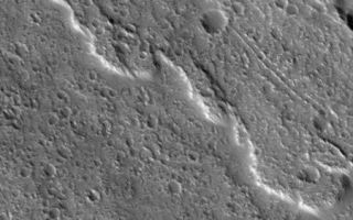 <h1>PIA04289:  Flows of Ascraeus</h1><div class="PIA04289" lang="en" style="width:450px;text-align:left;margin:auto;background-color:#000;padding:10px;max-height:150px;overflow:auto;"><p>11 September 2005<br />This Mars Global Surveyor (MGS) Mars Orbiter Camera (MOC) image shows heavily-cratered lava flows on the slopes of the martian volcano, Ascraeus Mons. The mountain is a classic shield volcano, similar in many respects to the volcanoes of Hawai'i. Shield volcanoes typically form from silica-, oxygen-, and aluminum-bearing rocks that are enriched in iron and magnesium -- that is, basalt. The lava flows of Ascraeus Mons are most likely basaltic, as are the volcanic rocks in Gusev Crater that were examined by the Mars Exploration Rover, Spirit, during its first year on the martian surface.<p>Location near: 10.3°N, 103.5°W <br />Image width: width: ~3 km (~1.9 mi) <br />Illumination from: lower left <br />Season: Northern Autumn </p><br /><br /><a href="http://photojournal.jpl.nasa.gov/catalog/PIA04289" onclick="window.open(this.href); return false;" title="Voir l'image 	 PIA04289:  Flows of Ascraeus	  sur le site de la NASA">Voir l'image 	 PIA04289:  Flows of Ascraeus	  sur le site de la NASA.</a></div>