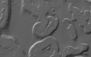 <h1>PIA04295:  Four Mars Years of South Polar Changes</h1><div class="PIA04295" lang="en" style="width:661px;text-align:left;margin:auto;background-color:#000;padding:10px;max-height:150px;overflow:auto;"><a href="/figures/PIA04295_fig1.jpg"></a><a href="/figures/PIA04295_fig2.jpg"><a href="/figures/PIA04295_fig3.jpg"><a href="/figures/PIA04295_fig4.jpg"></a><b>View in 1999</b><b>View in 2001</b><b>View in 2003</b><b>View in 2005</b><p>One of the most profound discoveries that would not have been possible if NASA's Mars Global Surveyor mission had not been extended beyond its primary mission of one Mars year (687 Earth days) is that of dramatic changes that take place in the south polar residual ice cap each martian year. To make this discovery, the Mars Orbiter Camera on the spacecraft had to be employed during a second Mars year to repeat images of sites on the south polar cap that had been imaged during the primary mission. </p><p>The initial discovery was made in 2001, when the camera team repeated images of portions of the south polar cap that had already been imaged in 1999. The goal of these images was to obtain stereo views, which would allow investigators to see the topography of the cap in three dimensions and to measure the thickness of the polar ice layers. </p><p>It was not possible to produce the desired 3-D views. To the team's surprise, the landforms of the south polar cap had changed. </p><p>The south polar residual cap -- that is, the portion of the ice cap that remains bright and retains ice throughout the southern summer season -- was seen in 1997 and 1999 images to have a complex terrain of broad, relatively flat mesas, small buttes, and many pits and troughs. Pits are generally circular and in some areas visually resemble a stack of thin slices of Swiss cheese. Very early in the Mars Global Surveyor mission, the Mars Orbiter Camera team speculated that these landforms must be carved into frozen carbon dioxide, because they look so unfamiliar and because Viking orbiter infrared measurements indicated that the south polar cap is cold enough consist of frozen carbon dioxide, even in summer.</p><p>The observations made by Mars Orbiter Camera in 2001, during the first part of the extended mission, showed that the scarps and pit walls of the south polar cap had retreated at an average rate of about 3 meters (10 feet) since 1999. In other words, they were retreating 3 meters per Mars year (and, of course, most of that retreat takes place during the summer). In some places on the cap, the scarps retreat less than 3 meters a Mars year, and in others it can retreat as much as 8 meters (26 feet) per martian year. </p><p>Of the two volatile materials one is likely to find in a frozen state on Mars -- water and carbon dioxide -- it is carbon dioxide that is volatile enough to permit scarp retreat rates like those observed by the Mars Orbiter Camera. </p><p>Over time, south polar pits merge to become plains, mesas turn into buttes, and buttes vanish forever. Since 2001, two additional Mars years have elapsed. A scientific benefit of having a long extended mission for Mars Global Surveyor has been the opportunity to document how the polar cap is changing each year. </p><p>Four images are shown here, plus an animation at left presenting the four frames in sequence. The location is near 86.3 degrees south latitude, 49.4 degrees west longitude, and the images show the same portion of the south polar residual cap as it appeared in 1999, 2001, 2003, and 2005. Comparing the images or viewing the animation makes it evident that the landscape of the south polar cap has been changing rapidly over the past four martian years. </p><p>Each year that Mars Global Surveyor has been in orbit, the landforms of the south polar residual cap have gotten smaller, and the carbon dioxide removed from the cap has not been re-deposited. The implication is that Mars presently has a warm (and possibly warming) climate, with new carbon dioxide going into the atmosphere every year. The other implication is that, at some time in the not-too-distant past, the planet had a colder climate, so that the layers of carbon dioxide could be deposited in the first place. If one takes the rate of scarp retreat and projects it backwards to fill in all of the pits and troughs with the carbon dioxide that has been removed from them, one finds that the colder climate might only have occurred a few centuries to a few tens of thousands of years ago. This kind of time scale is not unlike that of the climate changes that have been recorded on Earth, including the Ice Ages and the smaller fluctuations that have occurred since the last Ice Age (e.g., the "Little Ice Age" of the mid-14th through mid-19th centuries). </p><p>After the discovery that the pits were enlarging and that we were not seeing carbon-dioxide deposition, it was suggested that interannual variations might be large enough to permit such deposition on a short timescale. However, two Mars years of additional observations show no large magnitude annual differences. Variations that would permit carbon dioxide deposition may require decades. And to see such variations may require many more Mars years of observations by orbiting spacecraft. </p><p>The Mars Orbiter Camera was built and is operated by Malin Space Science Systems, San Diego, Calif. Mars Global Surveyor left Earth on Nov. 7, 1996, and began orbiting Mars on Sept. 12, 1997. JPL, a division of the California Institute of Technology, Pasadena, manages Mars Global Surveyor for NASA's Science Mission Directorate, Washington.</p><br /><br /><a href="http://photojournal.jpl.nasa.gov/catalog/PIA04295" onclick="window.open(this.href); return false;" title="Voir l'image 	 PIA04295:  Four Mars Years of South Polar Changes	  sur le site de la NASA">Voir l'image 	 PIA04295:  Four Mars Years of South Polar Changes	  sur le site de la NASA.</a></div>