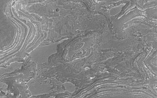 <h1>PIA04487:  Layers Near Juventae Chasma</h1><div class="PIA04487" lang="en" style="width:540px;text-align:left;margin:auto;background-color:#000;padding:10px;max-height:150px;overflow:auto;">MGS MOC Release No. MOC2-346, 30 April 2003<p>This Mars Global Surveyor (MGS) Mars Orbiter Camera (MOC) picture obtained in April 2003 shows eroded layered rock outcrops near the southwest rim of Juventae Chasma in the southern hemisphere. This area is near 4.8°S, 63.7°W. Layers such as these record some fraction of the geologic history of Mars; however, that history cannot really be known from pictures alone. The erosional pattern of these layers suggests that they are sedimentary rocks. The area shown is about 3 km (1.9 mi) wide. Sunlight illuminates the scene from the upper left.<p><br /><br /><a href="http://photojournal.jpl.nasa.gov/catalog/PIA04487" onclick="window.open(this.href); return false;" title="Voir l'image 	 PIA04487:  Layers Near Juventae Chasma	  sur le site de la NASA">Voir l'image 	 PIA04487:  Layers Near Juventae Chasma	  sur le site de la NASA.</a></div>