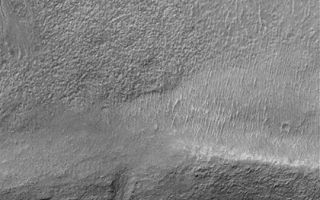 <h1>PIA04548:  Gullies in Terraced Crater Wall</h1><div class="PIA04548" lang="en" style="width:540px;text-align:left;margin:auto;background-color:#000;padding:10px;max-height:150px;overflow:auto;">MGS MOC Release No. MOC2-375, 29 May 2003<p>Gullies--possibly formed by a liquid such as water in the recent martian past--formed at two different levels in the walls of a meteor impact crater near 36.2°S, 185.5°W. This Mars Global Surveyor (MGS) Mars Orbiter Camera (MOC) image shows gullies in the upper crater wall (top of the image) and emergent from the slope of a lower terrace (bottom of the image). Sunlight illuminates the scene from the upper left.<p><br /><br /><a href="http://photojournal.jpl.nasa.gov/catalog/PIA04548" onclick="window.open(this.href); return false;" title="Voir l'image 	 PIA04548:  Gullies in Terraced Crater Wall	  sur le site de la NASA">Voir l'image 	 PIA04548:  Gullies in Terraced Crater Wall	  sur le site de la NASA.</a></div>