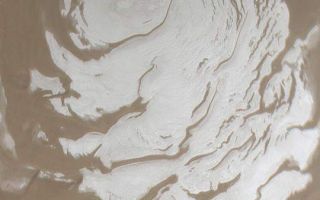 <h1>PIA04566:  South Polar Cap in Summer</h1><div class="PIA04566" lang="en" style="width:540px;text-align:left;margin:auto;background-color:#000;padding:10px;max-height:150px;overflow:auto;">MGS MOC Release No. MOC2-384, 7 June 2003<p>This Mars Global Surveyor (MGS) Mars Orbiter Camera (MOC) wide angle camera view of the martian south polar residual cap was acquired in March 2002, at the peak of the last southern summer. The ice at the surface of this summertime cap is mostly composed of carbon dioxide. The picture covers an area about 600 km (373 mi) wide near 90.0°S. Sunlight illuminates the scene from the lower right. Compare the view shown here with the appearance of the cap 1 Mars year earlier in April 2000 by visiting: <a href="http://www.msss.com/mars_images/moc/4_27_00_spcap/">MOC2-225, 27 April 2000, "South Polar Cap, Summer 2000"</a>.<p><br /><br /><a href="http://photojournal.jpl.nasa.gov/catalog/PIA04566" onclick="window.open(this.href); return false;" title="Voir l'image 	 PIA04566:  South Polar Cap in Summer	  sur le site de la NASA">Voir l'image 	 PIA04566:  South Polar Cap in Summer	  sur le site de la NASA.</a></div>