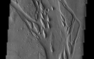 <h1>PIA04586:  Channels and Erosion</h1><div class="PIA04586" lang="en" style="width:486px;text-align:left;margin:auto;background-color:#000;padding:10px;max-height:150px;overflow:auto;"><p><a href="/figures/PIA04586_context.jpg"></a><br><p>Released 20 June 2003<p>The dissected and eroded channel observed in this THEMIS image taken of plains materials southwest of the volcano Elysium Mons shows typical erosional islands and depositional features. The interesting thing about this channel is that it appears to start out of nowhere. The MOLA context image shows that the channel originates from a fissure within the ground, whose origin is likely volcanic, but may also be related to volatile processes.<p>Image information: VIS instrument. Latitude 19.5, Longitude 126.8 East (233.2 West). 19 meter/pixel resolution.<p>Note: this THEMIS visual image has not been radiometrically nor geometrically calibrated for this preliminary release. An empirical correction has been performed to remove instrumental effects. A linear shift has been applied in the cross-track and down-track direction to approximate spacecraft and planetary motion. Fully calibrated and geometrically projected images will be released through the Planetary Data System in accordance with Project policies at a later time.<p>NASA's Jet Propulsion Laboratory manages the 2001 Mars Odyssey mission for NASA's Office of Space Science, Washington, D.C. The Thermal Emission Imaging System (THEMIS) was developed by Arizona State University, Tempe, in collaboration with Raytheon Santa Barbara Remote Sensing. The THEMIS investigation is led by Dr. Philip Christensen at Arizona State University. Lockheed Martin Astronautics, Denver, is the prime contractor for the Odyssey project, and developed and built the orbiter. Mission operations are conducted jointly from Lockheed Martin and from JPL, a division of the California Institute of Technology in Pasadena.<p><br /><br /><a href="http://photojournal.jpl.nasa.gov/catalog/PIA04586" onclick="window.open(this.href); return false;" title="Voir l'image 	 PIA04586:  Channels and Erosion	  sur le site de la NASA">Voir l'image 	 PIA04586:  Channels and Erosion	  sur le site de la NASA.</a></div>