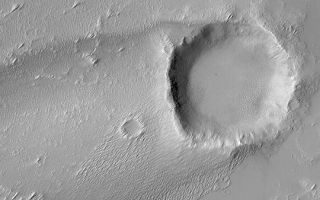 <h1>PIA04590:  Crater with Wind Streak</h1><div class="PIA04590" lang="en" style="width:540px;text-align:left;margin:auto;background-color:#000;padding:10px;max-height:150px;overflow:auto;">MGS MOC Release No. MOC2-401, 24 June 2003<p>This Mars Global Surveyor (MGS) Mars Orbiter Camera (MOC) image shows a streak formed by wind in the lee of a meteor impact crater. The winds responsible for the streak and the numerous smaller "tails" behind small obstacles all indicate that regional winds blow from the right/upper right (northeast) toward the left/lower left (southwest). The crater is located near 13.7°S, 131.5°W. Sunlight illuminates the scene from the left/upper left.<p><br /><br /><a href="http://photojournal.jpl.nasa.gov/catalog/PIA04590" onclick="window.open(this.href); return false;" title="Voir l'image 	 PIA04590:  Crater with Wind Streak	  sur le site de la NASA">Voir l'image 	 PIA04590:  Crater with Wind Streak	  sur le site de la NASA.</a></div>