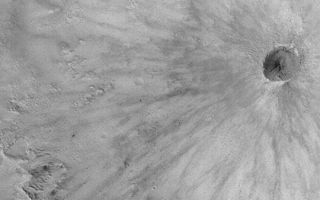 <h1>PIA04619:  Fresh, Rayed Impact Crater</h1><div class="PIA04619" lang="en" style="width:540px;text-align:left;margin:auto;background-color:#000;padding:10px;max-height:150px;overflow:auto;">MGS MOC Release No. MOC2-416, 9 July 2003<p>This Mars Global Surveyor (MGS) Mars Orbiter Camera (MOC) image shows a fresh, young meteor impact crater on the martian surface. It is less than 400 meters (less than 400 yards) across. While there is no way to know the exact age of this or any other martian surface feature, the rays are very well preserved. On a planet where wind can modify surface features at the present time, a crater with rayed ejecta patterns must be very young indeed. Despite its apparent youth, the crater could still be many hundreds of thousands, if not several million, of years old. This impact scar is located within the much larger Crommelin Crater, near 5.6°N, 10.0°W. Sunlight illuminates the scene from the left.<p><br /><br /><a href="http://photojournal.jpl.nasa.gov/catalog/PIA04619" onclick="window.open(this.href); return false;" title="Voir l'image 	 PIA04619:  Fresh, Rayed Impact Crater	  sur le site de la NASA">Voir l'image 	 PIA04619:  Fresh, Rayed Impact Crater	  sur le site de la NASA.</a></div>