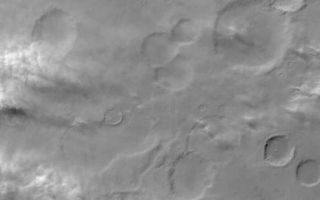<h1>PIA04686:  Dust-Raising Event in Noachis</h1><div class="PIA04686" lang="en" style="width:799px;text-align:left;margin:auto;background-color:#000;padding:10px;max-height:150px;overflow:auto;">MGS MOC Release No. MOC2-452, 14 August 2003<p />Mars is a desert world. Every day, somewhere on the planet, wind is picking up dust and moving it around. This Mars Global Surveyor (MGS) Mars Orbiter Camera (MOC) wide angle red camera image shows a portion of Noachis Terra on a winter afternoon as great gusts of wind lifted dust from a variety of surfaces all across the region. At the time the picture was acquired, winds were blowing from the northwest (left/upper left) toward the southeast (lower right). Located near 38°S, 330°W, this image covers an area approximately 252 km (158 mi) wide. Sunlight illuminates the scene from the upper left; some of the dust plumes can be seen to cast shadows toward the bottom/lower right (south/southeast).<br /><br /><a href="http://photojournal.jpl.nasa.gov/catalog/PIA04686" onclick="window.open(this.href); return false;" title="Voir l'image 	 PIA04686:  Dust-Raising Event in Noachis	  sur le site de la NASA">Voir l'image 	 PIA04686:  Dust-Raising Event in Noachis	  sur le site de la NASA.</a></div>