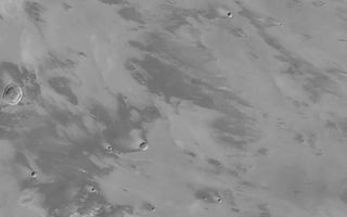 <h1>PIA04693:  Daedalia Planum Wind Streaks</h1><div class="PIA04693" lang="en" style="width:800px;text-align:left;margin:auto;background-color:#000;padding:10px;max-height:150px;overflow:auto;">MGS MOC Release No. MOC2-459, 21 August 2003<p />This Mars Global Surveyor (MGS) Mars Orbiter Camera (MOC) wide angle (red camera) image shows streaks in the lee of obstacles such as meteor impact craters and lava flow margins in southwestern Daedalia Planum. The image covers an area about 252 km (157 mi) across near 13°S, 142°W. The streaks indicate that the dominant winds blow toward the northwest (left/upper left). Sunlight illuminates the scene from the left/upper left.<br /><br /><a href="http://photojournal.jpl.nasa.gov/catalog/PIA04693" onclick="window.open(this.href); return false;" title="Voir l'image 	 PIA04693:  Daedalia Planum Wind Streaks	  sur le site de la NASA">Voir l'image 	 PIA04693:  Daedalia Planum Wind Streaks	  sur le site de la NASA.</a></div>