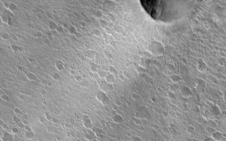 <h1>PIA04695:  Crater and Wind Streak</h1><div class="PIA04695" lang="en" style="width:799px;text-align:left;margin:auto;background-color:#000;padding:10px;max-height:150px;overflow:auto;">MGS MOC Release No. MOC2-461, 23 August 2003<p />This Mars Global Surveyor (MGS) Mars Orbiter Camera (MOC) image shows a crater with a bright wind streak in southern Acidalia Planitia. The streak is mostly likely a very thin coating of dust. The orientation of the streak indicates that the winds responsible for its formation and maintenance came from the northeast (upper right) and blew toward the lower left (southwest). The crater is located near 24.8°N, 39.1°W. The image covers an area 3 km (1.9 mi) wide. Sunlight illuminates the scene from the lower left.<br /><br /><a href="http://photojournal.jpl.nasa.gov/catalog/PIA04695" onclick="window.open(this.href); return false;" title="Voir l'image 	 PIA04695:  Crater and Wind Streak	  sur le site de la NASA">Voir l'image 	 PIA04695:  Crater and Wind Streak	  sur le site de la NASA.</a></div>