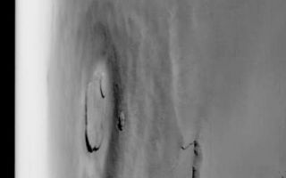 <h1>PIA04737:  Oblique Olympus Mons</h1><div class="PIA04737" lang="en" style="width:394px;text-align:left;margin:auto;background-color:#000;padding:10px;max-height:150px;overflow:auto;">MGS MOC Release No. MOC2-479, 10 September 2003<p />This is a red camera wide angle view of the giant martian volcano, Olympus Mons, acquired by the Mars Global Surveyor (MGS) Mars Orbiter Camera (MOC). The volcano is large enough to cover much of the U.S. state of New Mexico. This view was taken looking west toward the sunward limb of the planet. The limb is the horizon to the left; the dark band is outer space. Sunlight illuminates this scene from the lower left.<br /><br /><a href="http://photojournal.jpl.nasa.gov/catalog/PIA04737" onclick="window.open(this.href); return false;" title="Voir l'image 	 PIA04737:  Oblique Olympus Mons	  sur le site de la NASA">Voir l'image 	 PIA04737:  Oblique Olympus Mons	  sur le site de la NASA.</a></div>