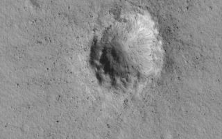 <h1>PIA04776:  Small Impact Crater</h1><div class="PIA04776" lang="en" style="width:800px;text-align:left;margin:auto;background-color:#000;padding:10px;max-height:150px;overflow:auto;">MGS MOC Release No. MOC2-502, 3 October 2003<p />This May 2003 Mars Global Surveyor (MGS) Mars Orbiter Camera (MOC) image provides a high resolution view (1.5 meters--5 feet--per pixel) of a small meteor crater near 28.0°N, 182.8°W. This crater is about 300 m (~980 feet) across, just under one-third the size of the famous Meteor Crater in northern Arizona, U.S.A. Boulders ejected by the impact dot the scene. Sunlight illuminates the crater from the lower left.<br /><br /><a href="http://photojournal.jpl.nasa.gov/catalog/PIA04776" onclick="window.open(this.href); return false;" title="Voir l'image 	 PIA04776:  Small Impact Crater	  sur le site de la NASA">Voir l'image 	 PIA04776:  Small Impact Crater	  sur le site de la NASA.</a></div>